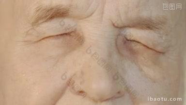 慢镜头和特写的老年妇女的脸，她睁开眼睛，看着相机，然后再闭上